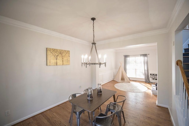 2019 Chelton Way SE, Smyrna, GA 30080 - dining room featuring stairs, ornamental molding, wood finished floors, and a chandelier