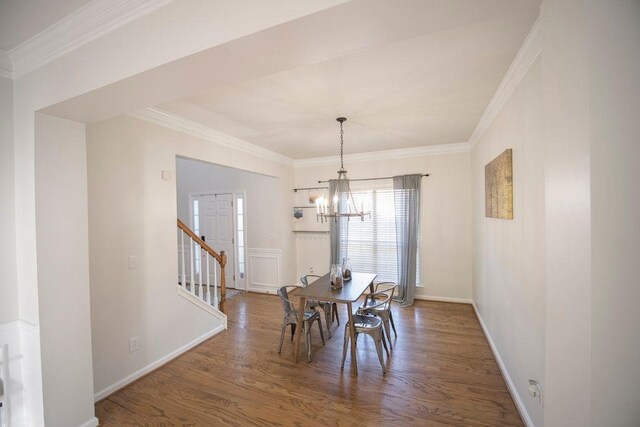 2019 Chelton Way SE, Smyrna, GA 30080 - dining room with a chandelier, wood finished floors, crown molding, and baseboards
