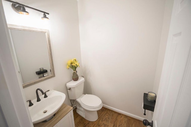 2019 Chelton Way SE, Smyrna, GA 30080 - bathroom featuring baseboards, wood finished floors, vanity, and toilet