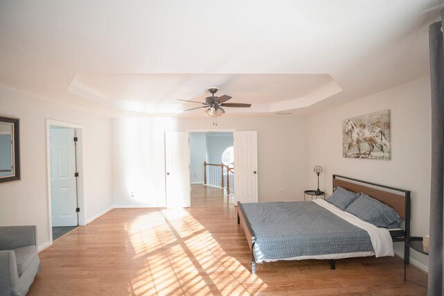 2019 Chelton Way SE, Smyrna, GA 30080 - bedroom with a raised ceiling, light wood finished floors, baseboards, and ceiling fan