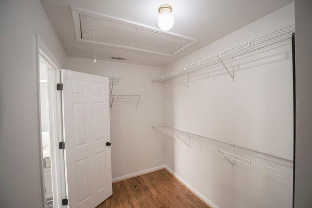 2019 Chelton Way SE, Smyrna, GA 30080 - spacious closet with attic access, wood finished floors, and visible vents