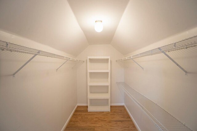 2019 Chelton Way SE, Smyrna, GA 30080 - walk in closet featuring lofted ceiling and wood finished floors