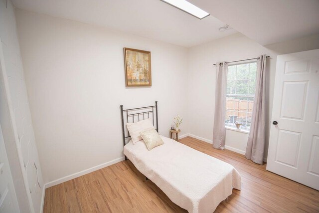 2019 Chelton Way SE, Smyrna, GA 30080 - bedroom featuring light wood-type flooring and baseboards