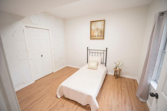 2019 Chelton Way SE, Smyrna, GA 30080 - bedroom featuring light wood-style flooring, baseboards, and a closet