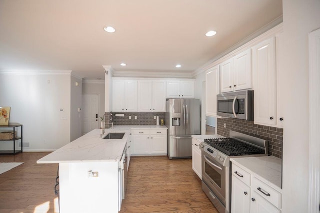 2019 Chelton Way SE, Smyrna, GA 30080 - kitchen with a peninsula, white cabinetry, stainless steel appliances, and a sink