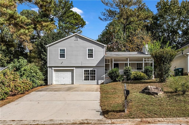 split level home with a porch and a garage