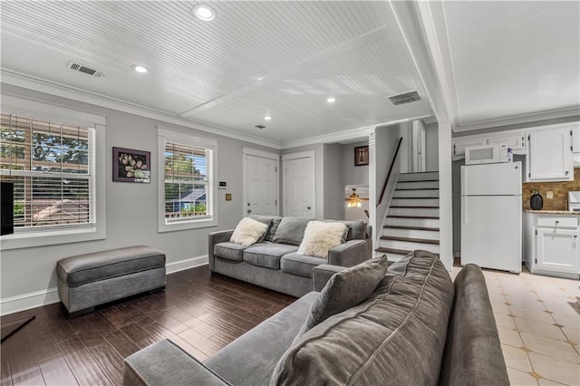 living room with ornamental molding and hardwood / wood-style floors