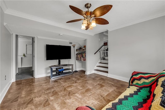 living room featuring ceiling fan and ornamental molding