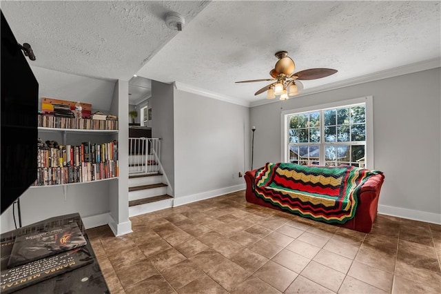 living area with crown molding, a textured ceiling, tile patterned flooring, and ceiling fan