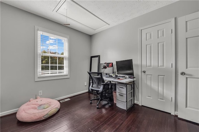 office space featuring a textured ceiling and dark hardwood / wood-style floors