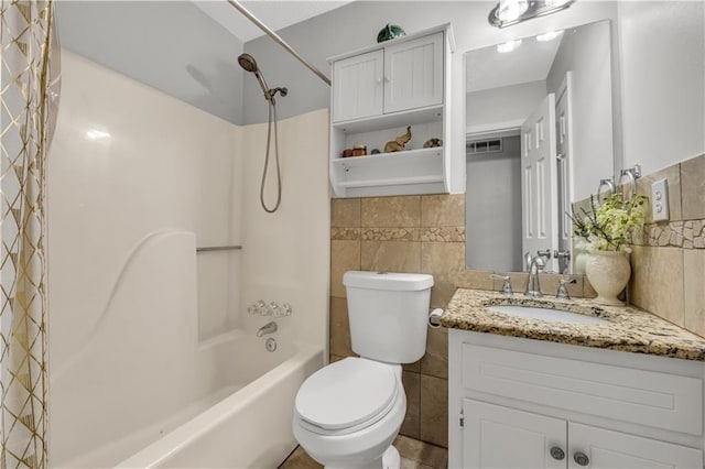 full bathroom with vanity, toilet, shower / bath combination with curtain, and tile walls