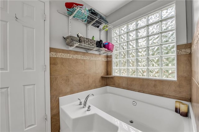 bathroom with tile walls and a washtub