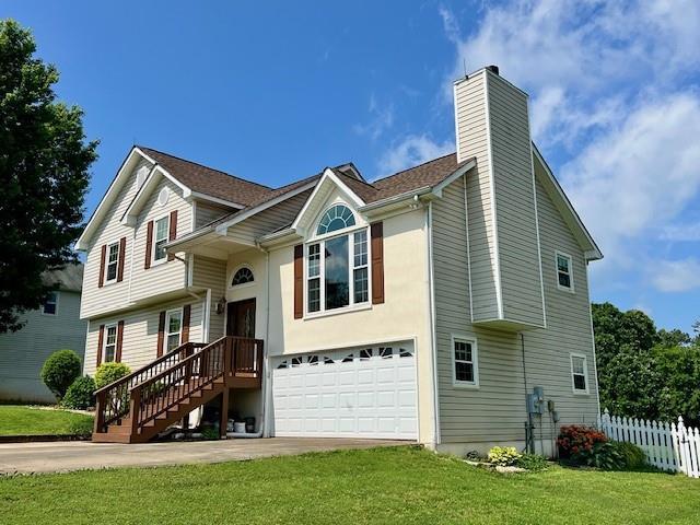 19 Magnolia Ct NE, Rydal, GA 30171 - view of front of home featuring a garage, a chimney, and concrete driveway