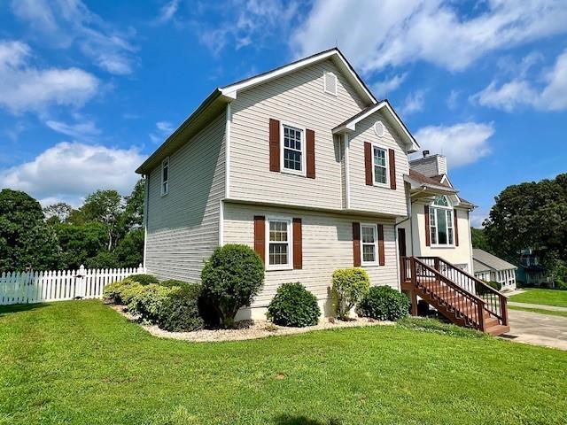 19 Magnolia Ct NE, Rydal, GA 30171 - view of front of home with a chimney