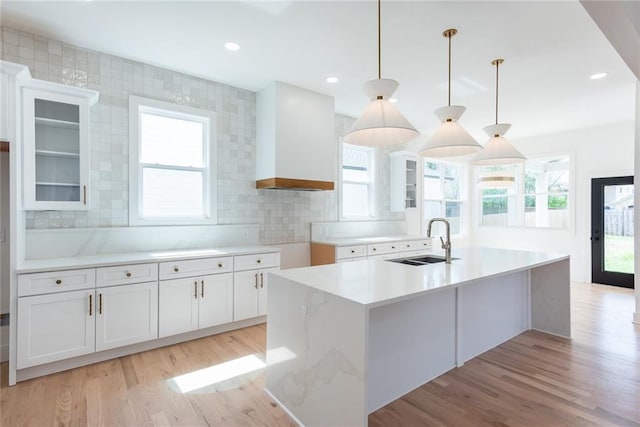 3395 Lee St, East Point, GA 30344 - kitchen with a sink, plenty of natural light, a kitchen island with sink, and white cabinets