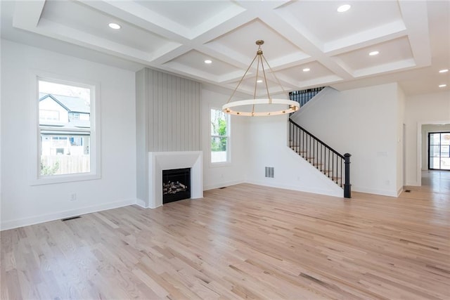 3395 Lee St, East Point, GA 30344 - unfurnished living room featuring visible vents, coffered ceiling, baseboards, stairs, and light wood-style floors
