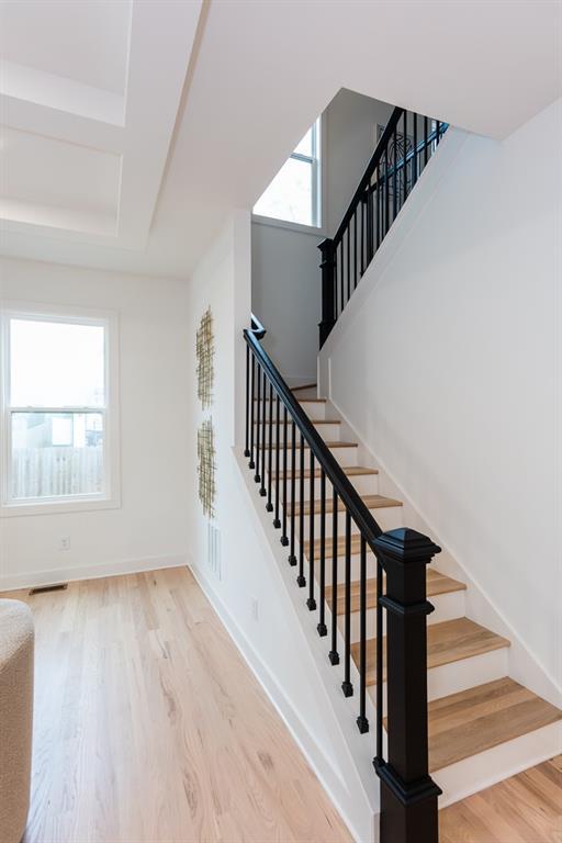 3395 Lee St, East Point, GA 30344 - stairway with visible vents, baseboards, and wood finished floors