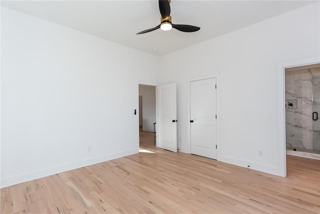 3395 Lee St, East Point, GA 30344 - unfurnished bedroom with ensuite bath, baseboards, light wood finished floors, and ceiling fan