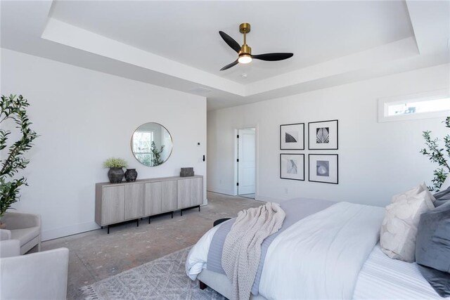 3395 Lee St, East Point, GA 30344 - bedroom featuring a tray ceiling, multiple windows, concrete flooring, and ceiling fan
