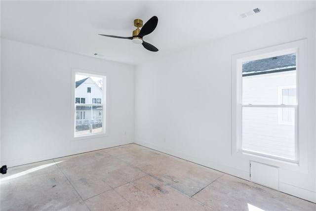 3395 Lee St, East Point, GA 30344 - spare room featuring visible vents, baseboards, concrete floors, and a ceiling fan