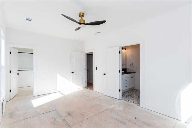 3395 Lee St, East Point, GA 30344 - unfurnished bedroom with a closet, visible vents, connected bathroom, and a walk in closet