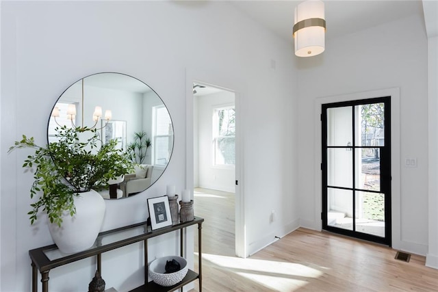 3395 Lee St, East Point, GA 30344 - entryway with visible vents, light wood-style floors, and baseboards