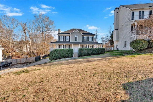 view of front of home featuring a front yard and a porch