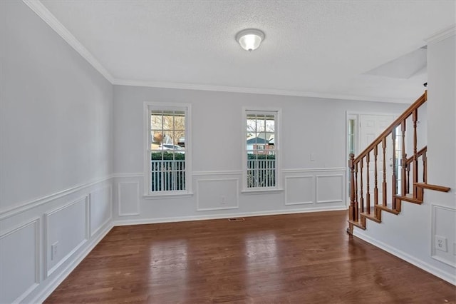 interior space featuring dark hardwood / wood-style floors and ornamental molding