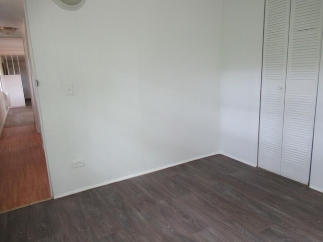 1779 New Bridge Rd, Cleveland, GA 30528 - unfurnished bedroom with dark wood-type flooring, baseboards, and a closet