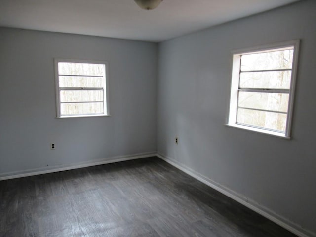 1779 New Bridge Rd, Cleveland, GA 30528 - empty room featuring dark wood-type flooring, healthy amount of natural light, and baseboards
