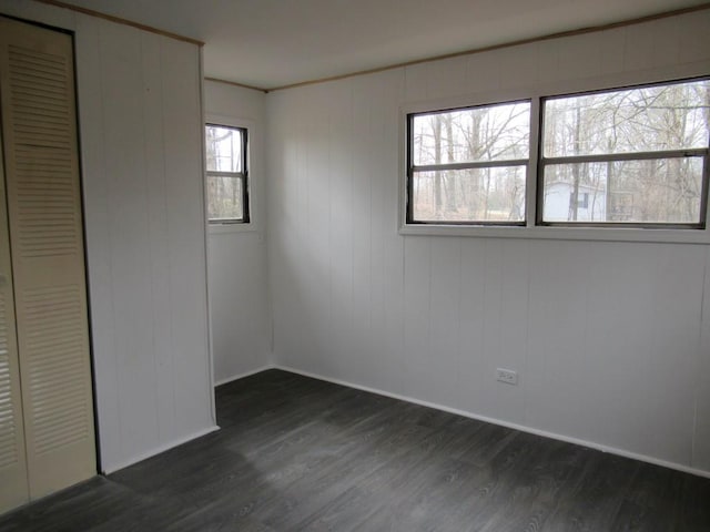 1779 New Bridge Rd, Cleveland, GA 30528 - unfurnished bedroom with dark wood-type flooring, baseboards, and a closet