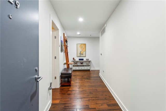 hall featuring dark wood-type flooring