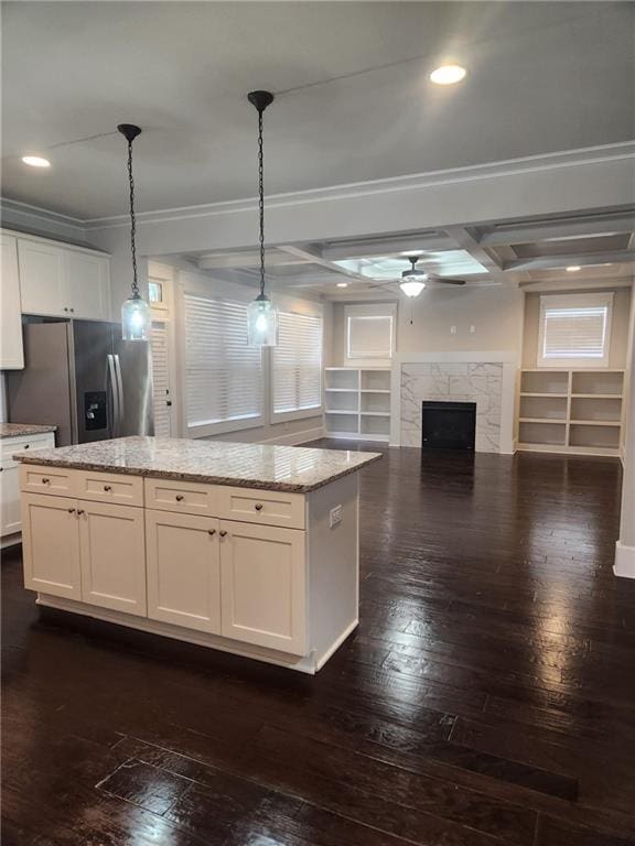 2439 Muirfield Pl, Atlanta, GA 30337 - kitchen with stainless steel refrigerator with ice dispenser, dark wood-style floors, a center island, crown molding, and a high end fireplace