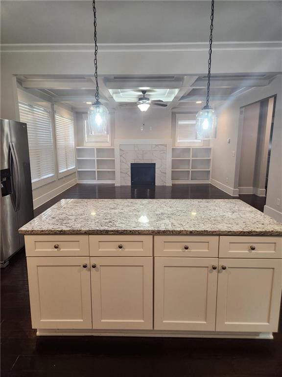 2439 Muirfield Pl, Atlanta, GA 30337 - kitchen with stainless steel fridge with ice dispenser, ceiling fan, baseboards, light stone countertops, and coffered ceiling