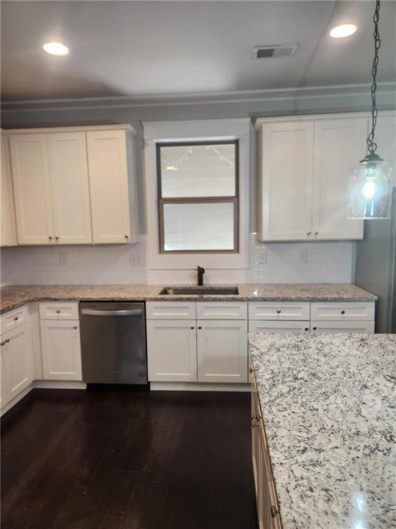 2439 Muirfield Pl, Atlanta, GA 30337 - kitchen with dishwasher, a sink, dark wood-type flooring, light stone countertops, and crown molding