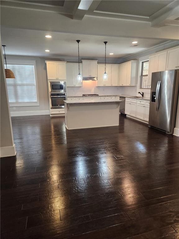 2439 Muirfield Pl, Atlanta, GA 30337 - kitchen with appliances with stainless steel finishes, healthy amount of natural light, recessed lighting, dark wood-style floors, and white cabinetry