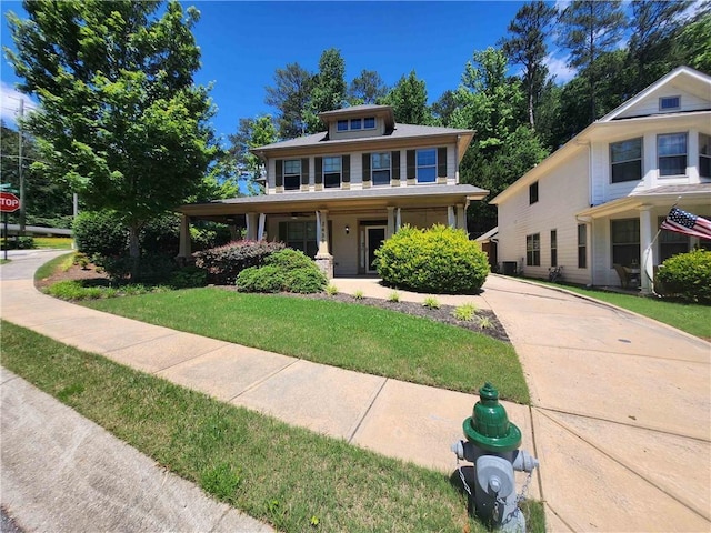 2439 Muirfield Pl, Atlanta, GA 30337 - american foursquare style home with a porch and a front lawn