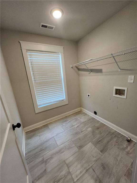 2439 Muirfield Pl, Atlanta, GA 30337 - laundry room with hookup for an electric dryer, hookup for a washing machine, and baseboards