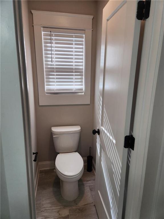 2439 Muirfield Pl, Atlanta, GA 30337 - bathroom featuring toilet and baseboards
