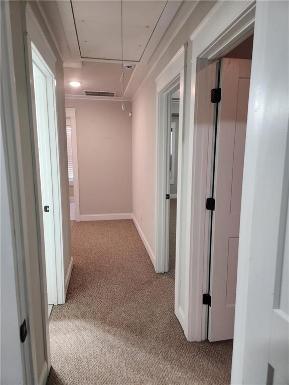 2439 Muirfield Pl, Atlanta, GA 30337 - corridor featuring attic access, carpet flooring, and baseboards