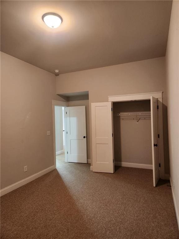 2439 Muirfield Pl, Atlanta, GA 30337 - unfurnished bedroom featuring carpet flooring, baseboards, and a closet
