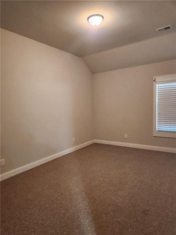2439 Muirfield Pl, Atlanta, GA 30337 - carpeted spare room with vaulted ceiling and baseboards