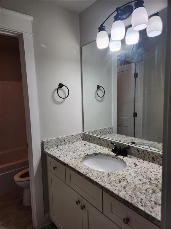 2439 Muirfield Pl, Atlanta, GA 30337 - bathroom with vanity and toilet