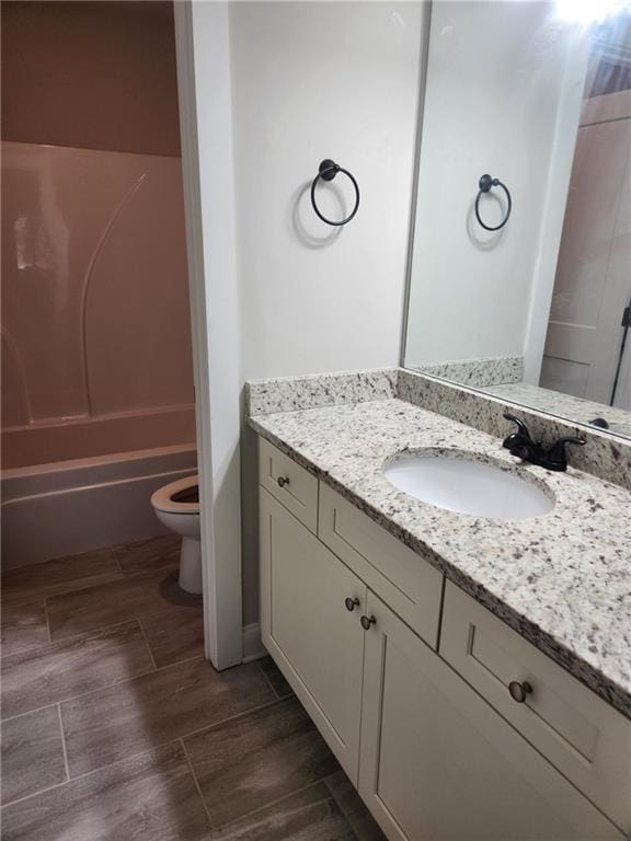 2439 Muirfield Pl, Atlanta, GA 30337 - full bathroom featuring vanity, toilet, and tub / shower combination