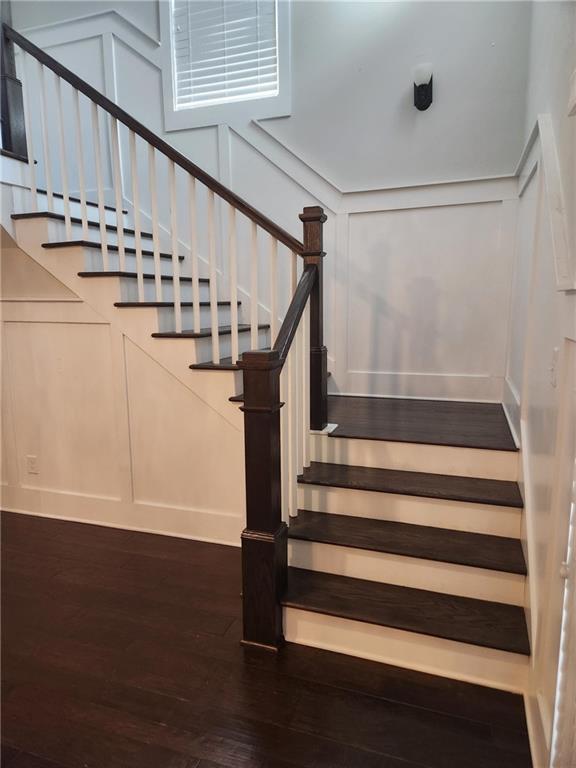 2439 Muirfield Pl, Atlanta, GA 30337 - stairs with a decorative wall and wood finished floors