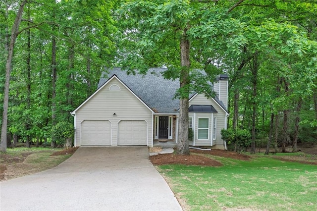 ranch-style home with an attached garage, concrete driveway, a front lawn, a chimney, and a shingled roof