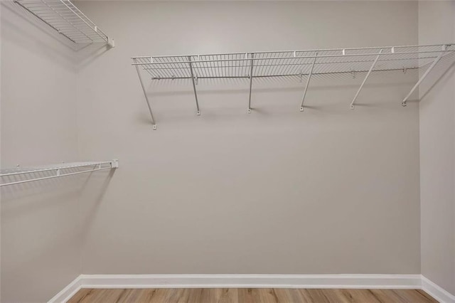 walk in closet featuring light wood-type flooring