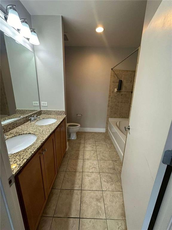 walk in closet featuring hardwood / wood-style flooring