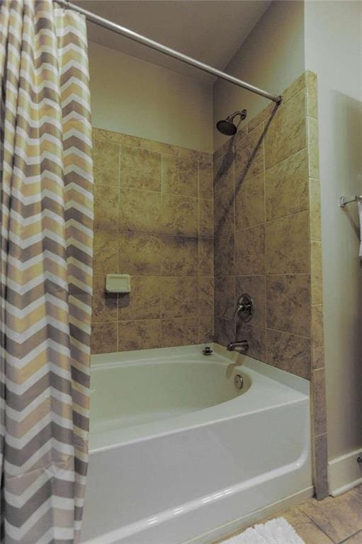 bathroom featuring tile patterned flooring and shower / bath combo with shower curtain