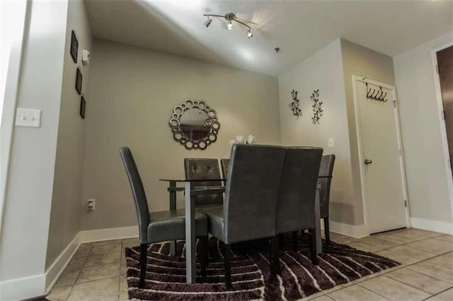 dining space with light tile patterned flooring